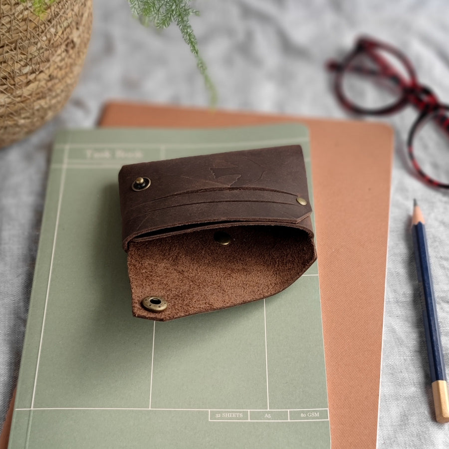 open brown leather wallet 