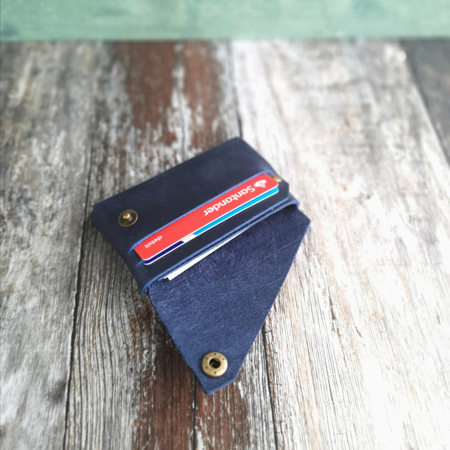 navy leather wallet in use 