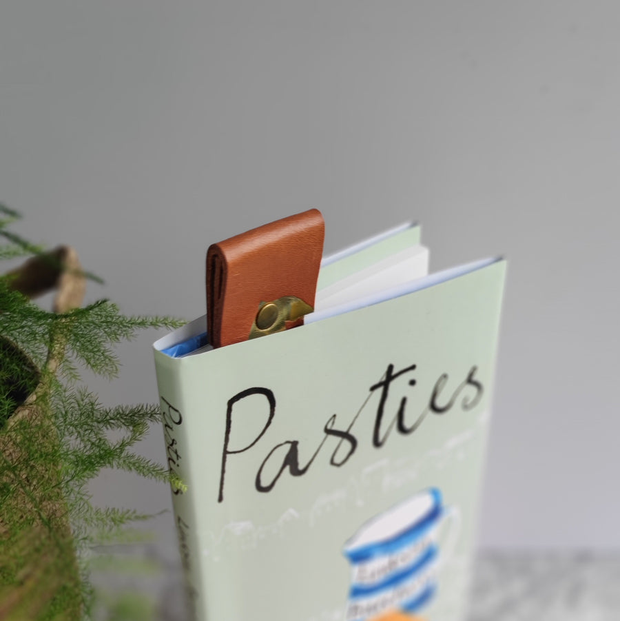 Leather bookmark in book