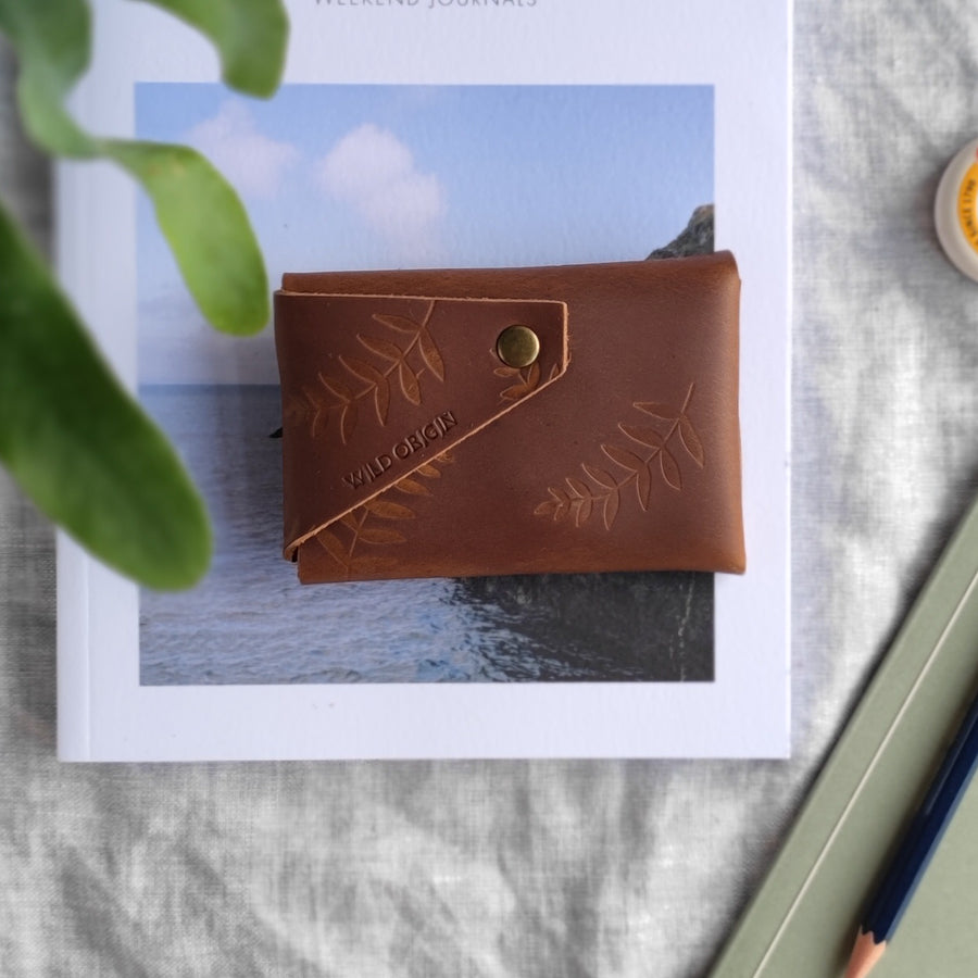 back of tan botanical leather wallet