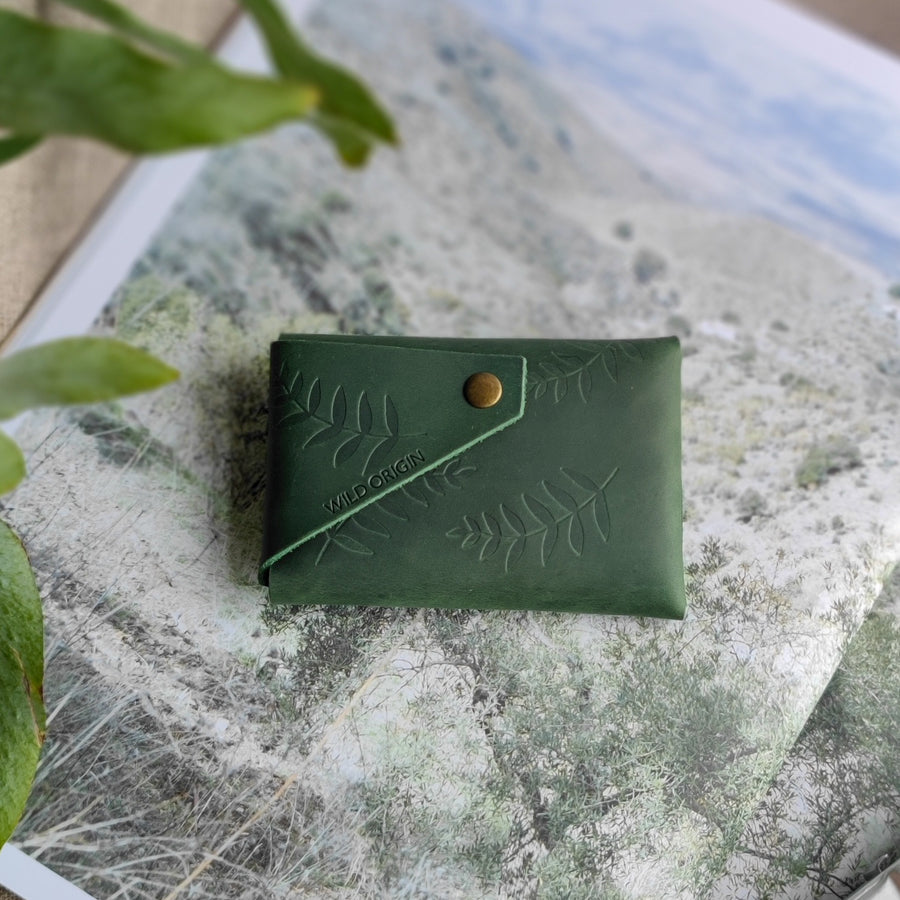 back of green leather wallet 