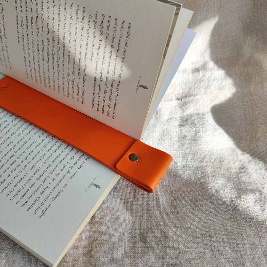 orange leather bookmark in use